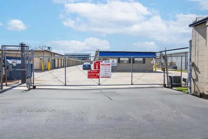 Fenched in Self Storage facility with signage